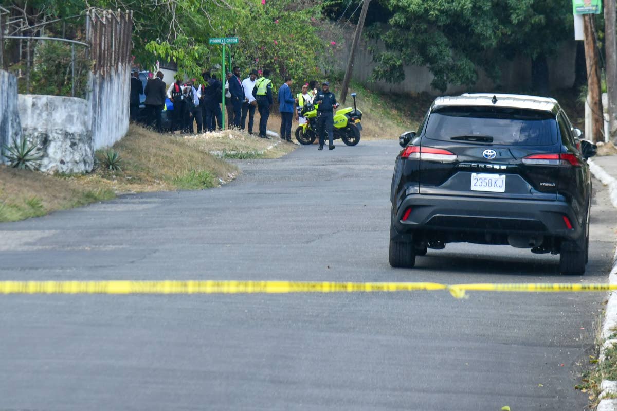 Cops at the Jacks Hill, St Andrew, scene where five men were killed on July 21 after an alleged gunfight when cops reportedly foiled a murder plot.