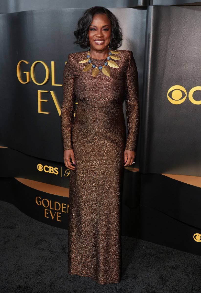 Viola Davis arrives at the Golden Globes Golden Eve: The Golden Globes Honor Heleen Mirren and Sarah Jessica Parker on Tuesday at The Beverly Hilton Hotel, in Beverly Hills, California, in a shiny bronze Oscar de la Renta gown and statement necklace. 