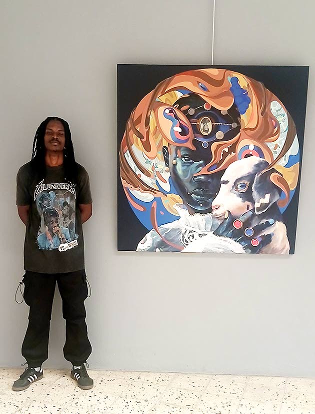 Curator Kevarney K.R. standing beside Taj Francis’ ‘Touched by a God in tears’ (2024).