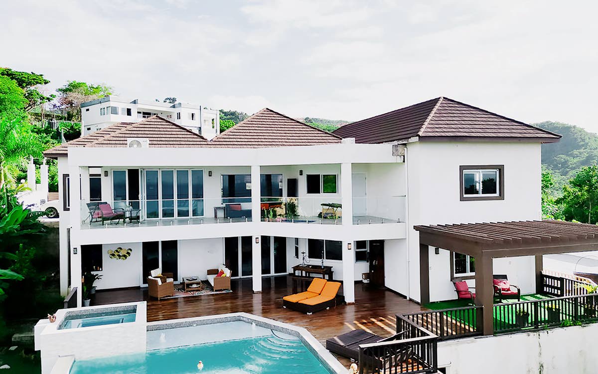 Darlene Rhoden, a travel specialist from Toronto, Canada, was captured by Jamaica on her first visit. Her love affair evolved from the human heart to architectural form, culminating in a breathtaking St James hillside home.