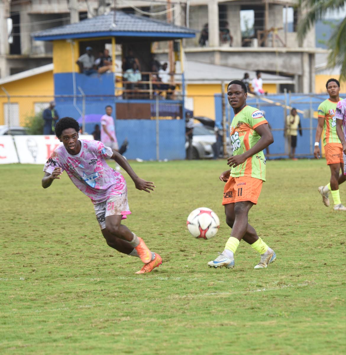 
All-Manning Selection’s and Jamaica College’s Dujoni Thompson (left) and All-daCosta Selection’s and Kemps Hill High’s Shemar Daley’s chase a ball during their ISSA All-daCosta vs All-Manning Cup match at the STETHS Sports Complex  yesterday.