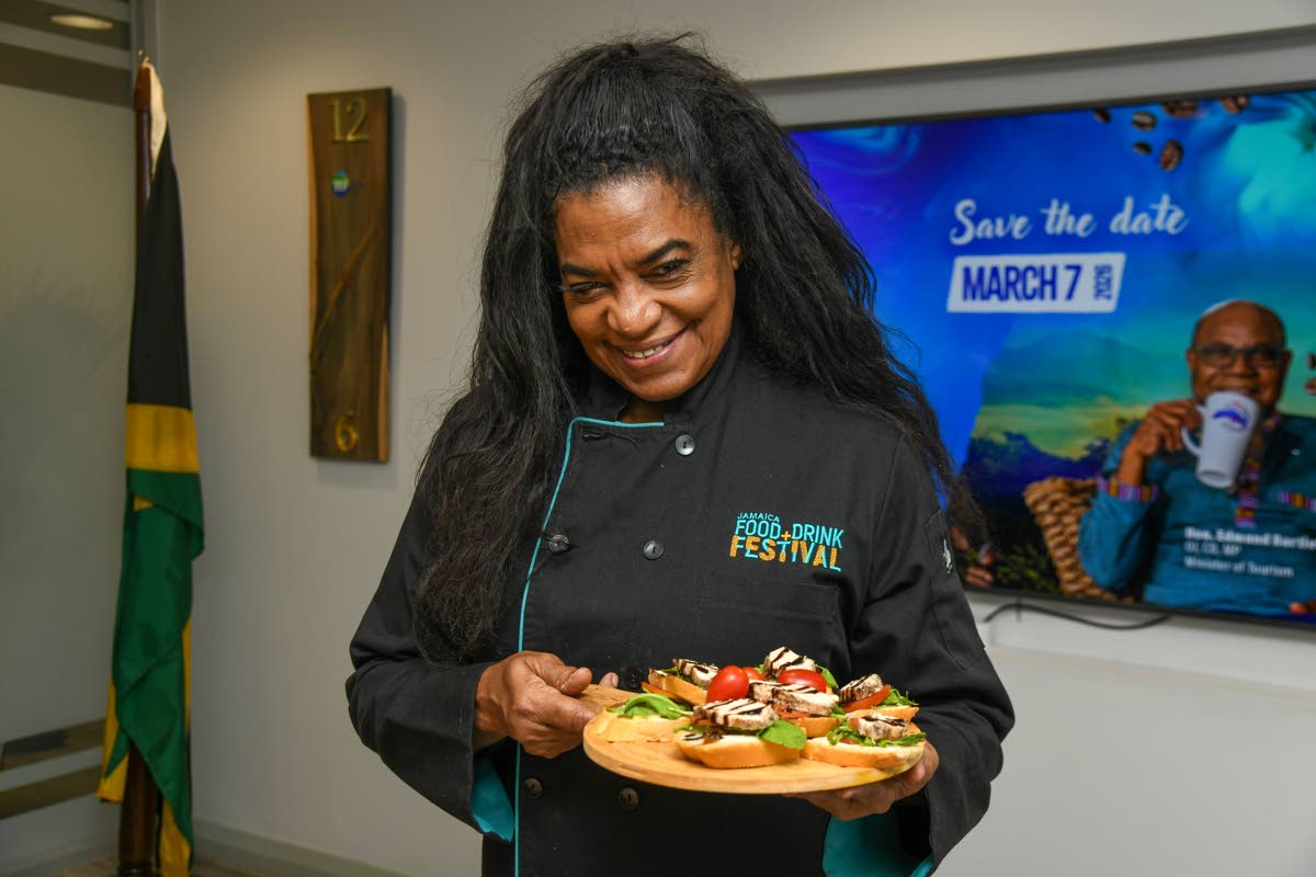 Chef Jacqui Tyson shows off her Blue Mountain Coffee-glazed jerk chicken breast crostini, topped with her signature coffee balsamic glaze, at the Jamaica Blue Mountain Coffee Day Celebration held at the Tourism Enhancement Fund Office in New Kingston, on J