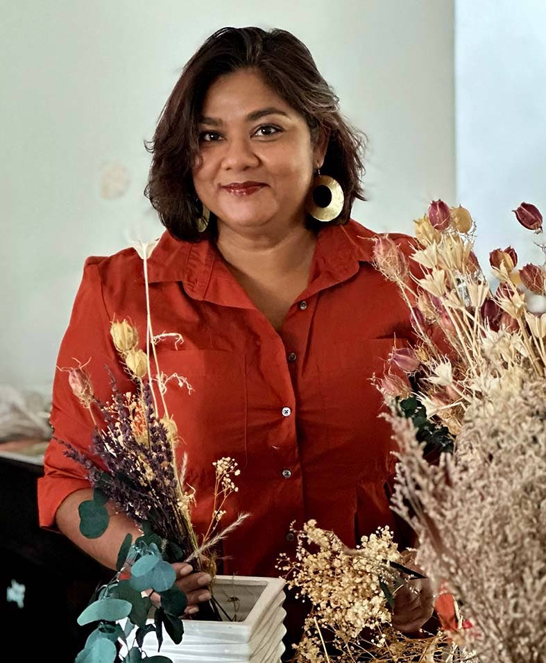 Cabean Badal, chief executive officer of Boho Botanics, with her floral arrangements.