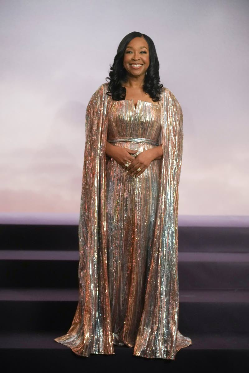 The mastermind executive producer and screenwriter Shonda Rhimes dazzles in a floor-length Elie Saab cape-embellished gown.