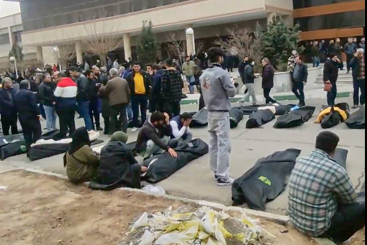 This frame grab from videos taken between January 9 and 11, 2026 and circulating on social media purportedly shows images from a morgue with dozens of bodies and mourners after crackdown on the outskirts of Iran's capital, in Kahrizak, Tehran Province. 