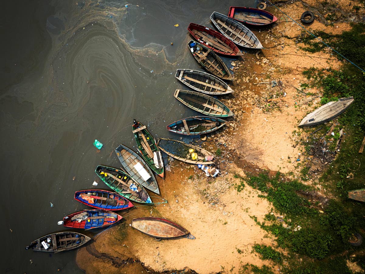Fishing boats sit on the shore of the Paraguay River in Mariano Roque Alonso, Paraguay.