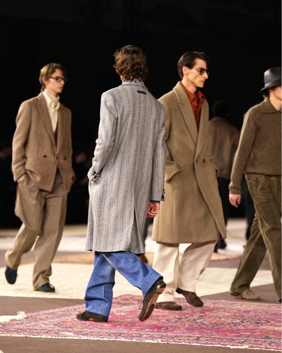 Above: The Zegna show, themed ‘A Family Closet’, was held under the Art Nouveau dome of Milan’s Palazzo del Ghiaccio and featured hues of honey, matte black, stone, olive and chestnut.