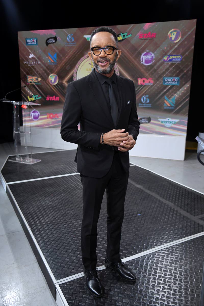 In his hosting capacity, Neville Bell brings his signature sharp style to the awards show.