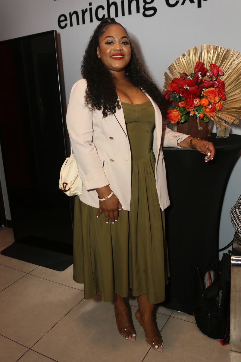 Kari Douglas, chief executive officer and qualifying director for Easton Douglas Consultants Ltd, opts for a cute look, pairing an olive-green midi dress with a tailored beige blazer.