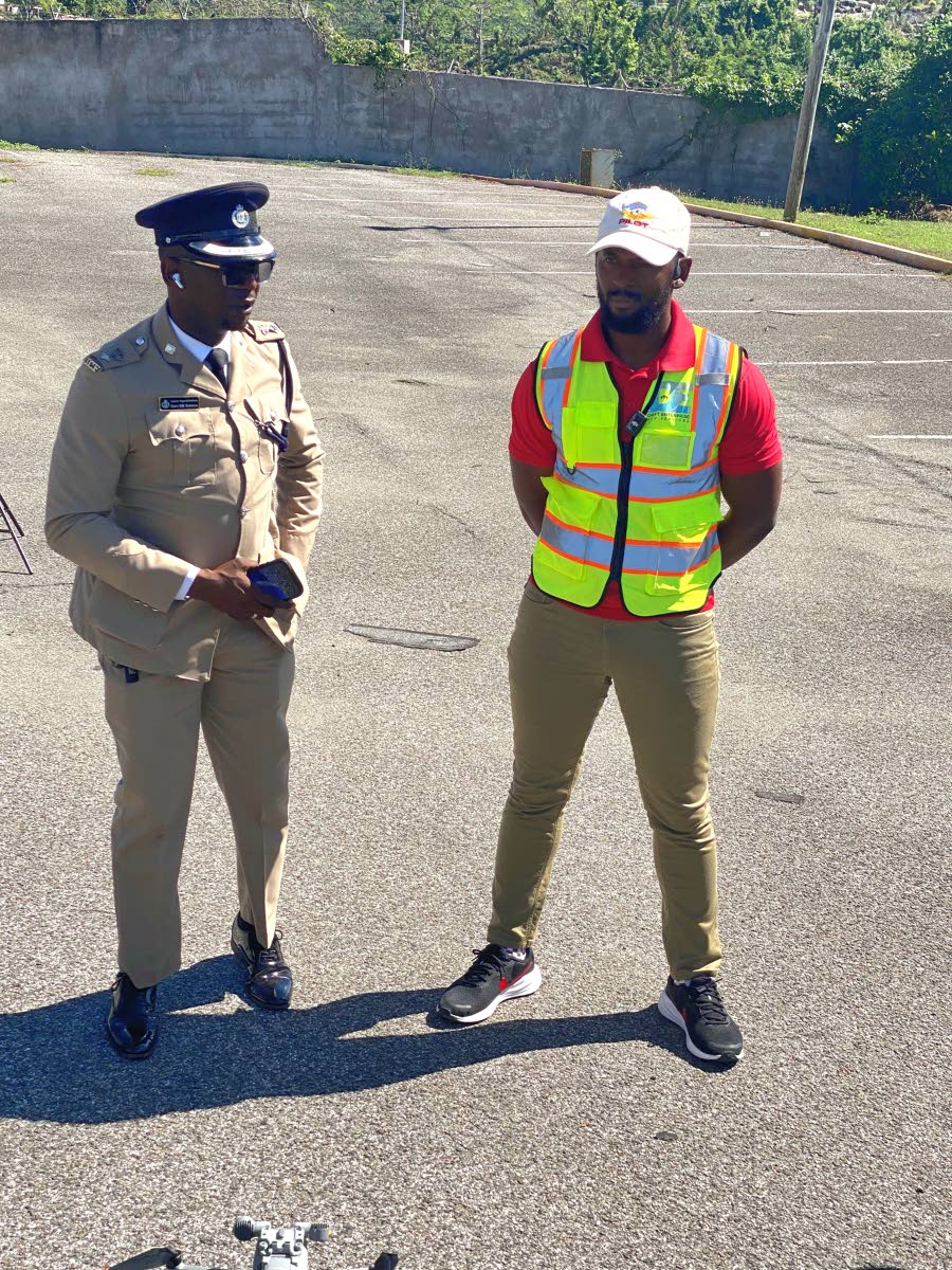 Senior Superintendent of Police Eron Samuels (left), commanding officer in charge of the St James Police Division, and Dervon McKellop, national drone soccer coach and Drones in Schools programme director, in conversation during the launch of a three-day d