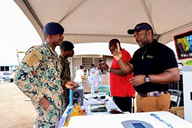 A JDF Credit Union member speaks with an exhibitor at the Annual House & Home Expo, exploring products for home ownership.
