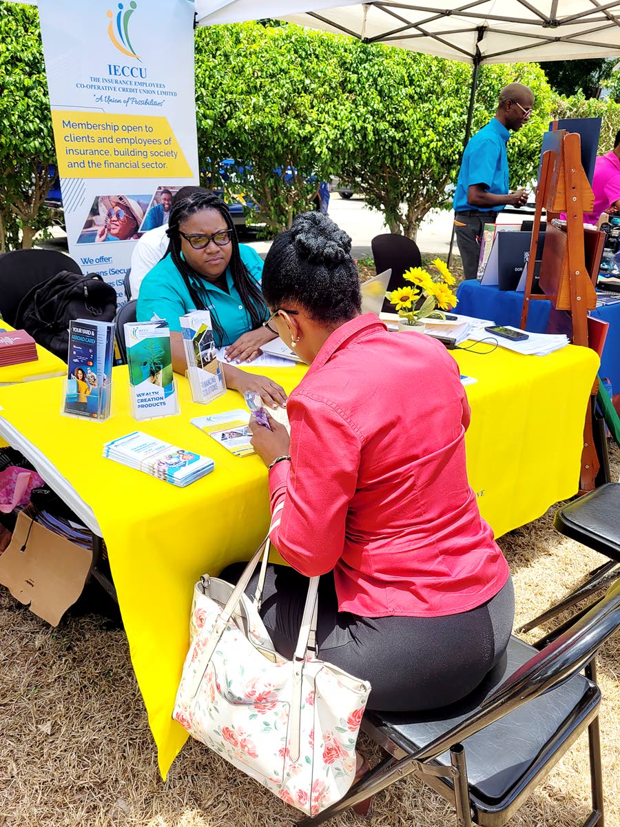  IECCU staff provide one-on-one financial guidance during a 2025 member outreach event, meeting members where they are to support their goals.