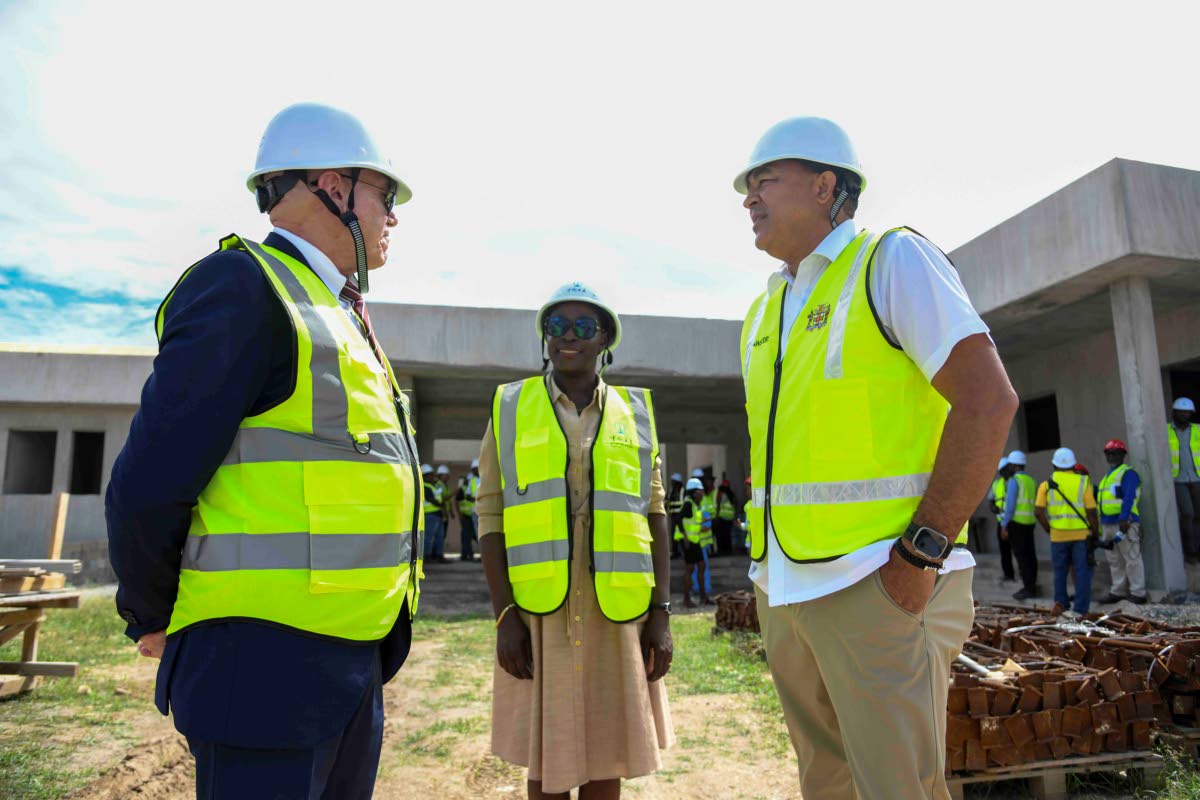 From left: Aniceto Rodríguez Ruiz, first counsellor and head of cooperation at the European Union; Vanna Lawrence, programme manager at the European Union; and Dr Christopher Tufton, Minister of Health and Wellness, in conversation following a tour of the