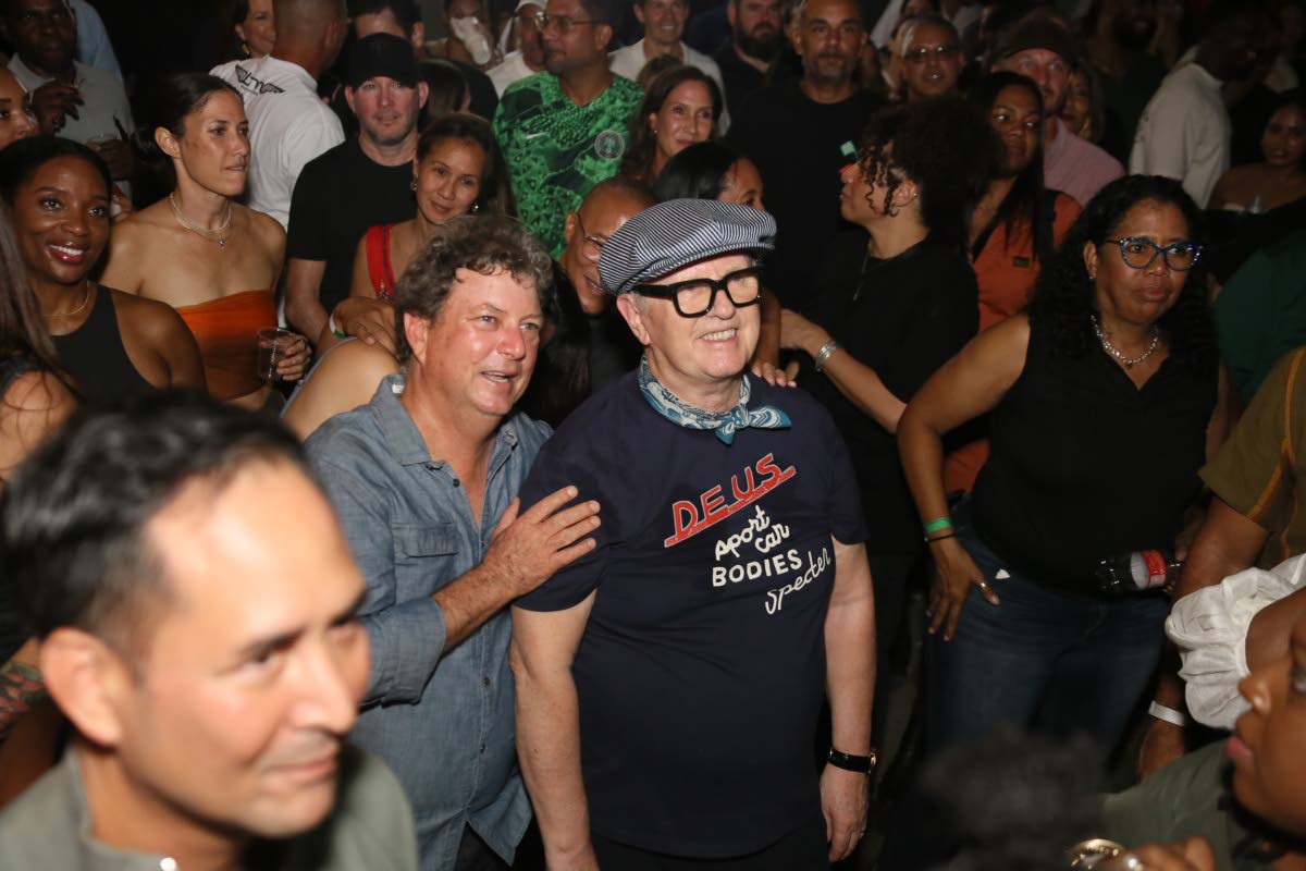 Jason Henzell (left) of Jakes Hotel and British-born disc jockey David Rodigan soaking up the high energy of Dubwise: Many Rivers to Cross held on West Kings House Road in St Andrew on January 23.