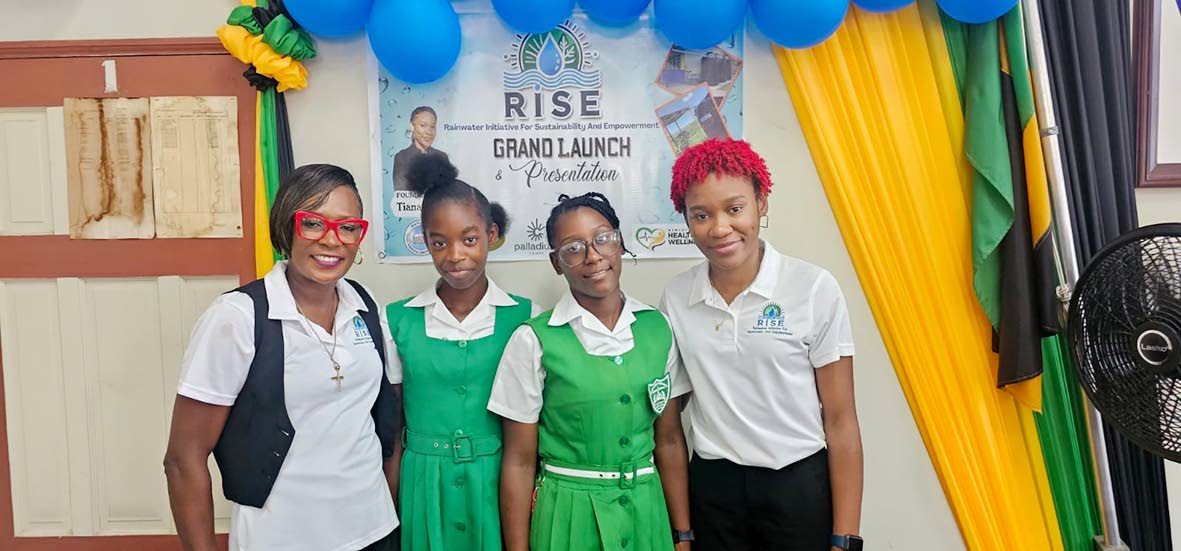 Tiana Dinham (right), with her mother, Andria Dehaney Grant (left), who is principal of the Maryland Primary and Infant School in Hanover, and students Kessania Brown and Anelia McIntosh.