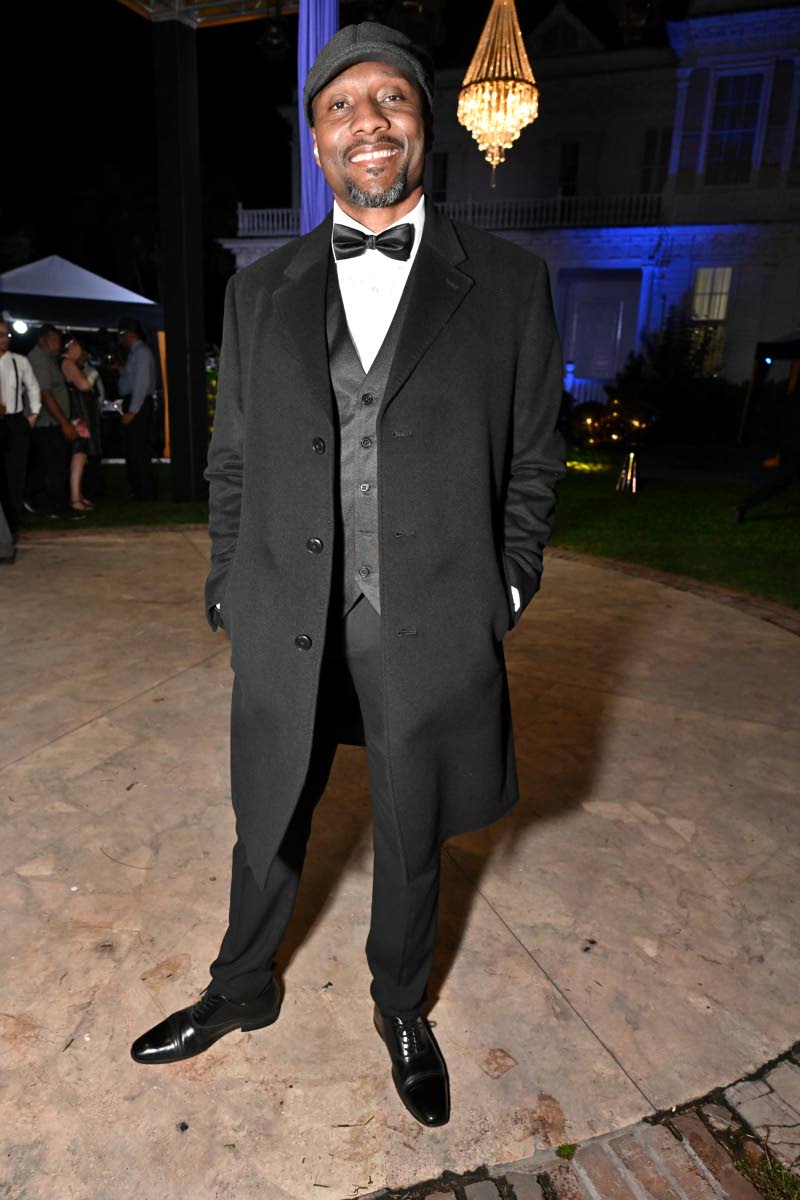 Levar Smith, CEO of Marathon Insurance Brokers, steps back in time in a three-piece suit, topped with a classic newsboy cap.