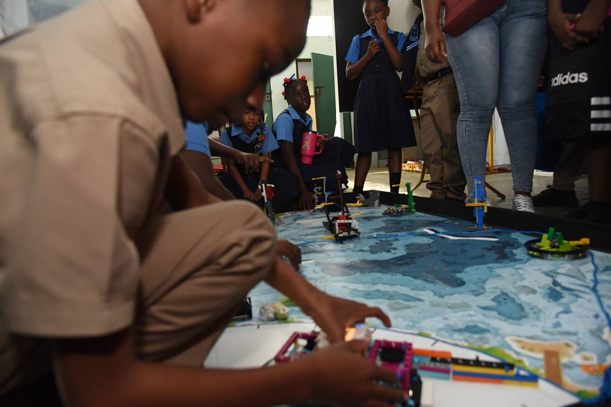 Students from the Beulah Primary and Infant School test their robots just before the start of the STEAM in Action Expo held at the Chinese Benevolent Association in St Andrew last Thursday.