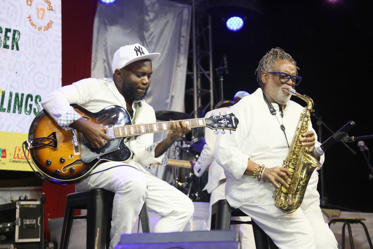 Kenroy Mullings (left) and Dean Fraser performing at Sunday’s Dennis Brown tribute concert.