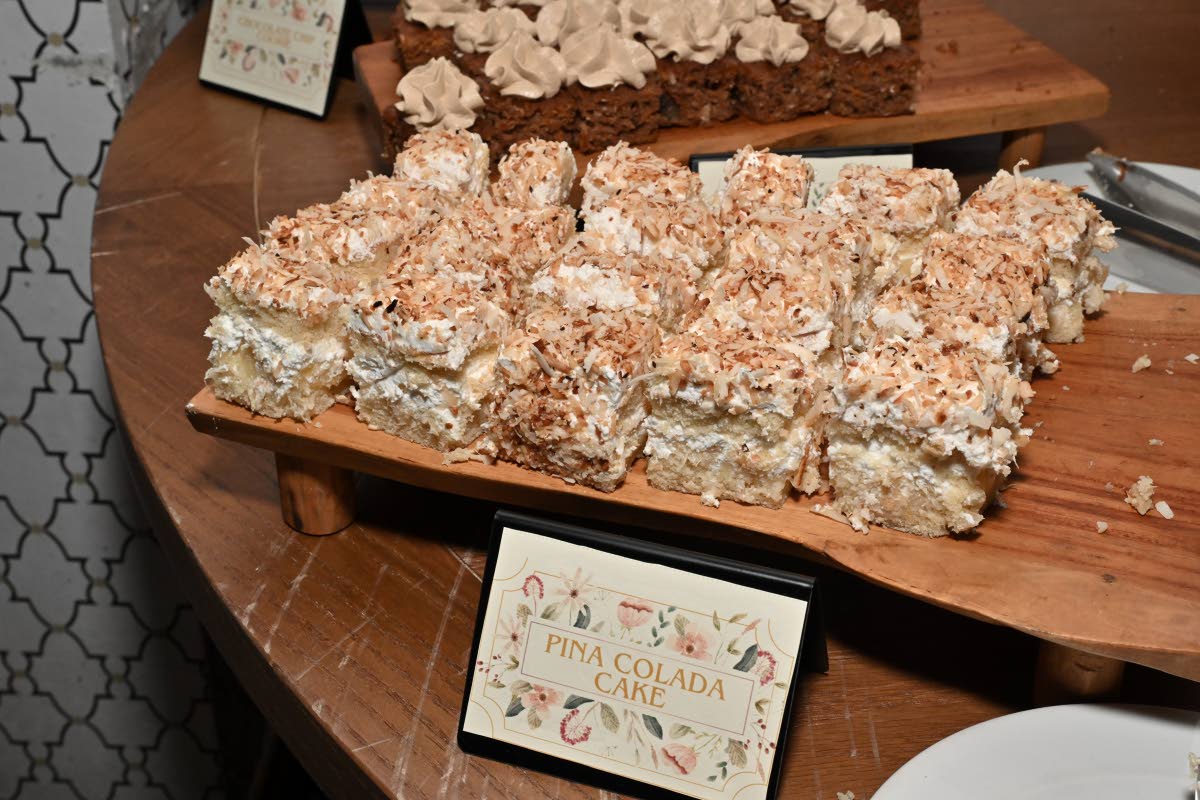 The pina colada cake presents soft, evenly layered sponge infused with coconut and pineapple, finished with a light, balanced sweetness.