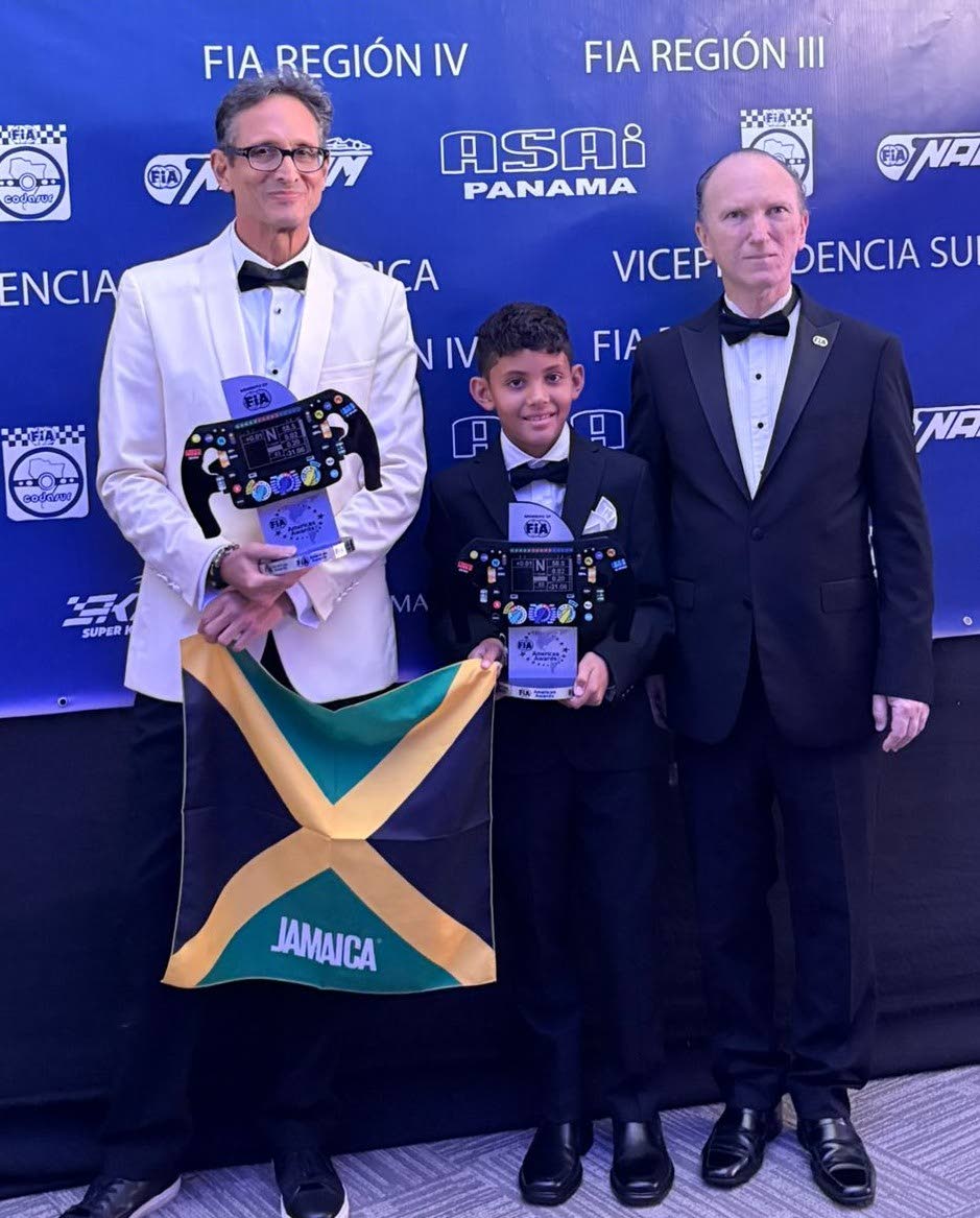 Kyle Mais (left) 2025 Overall Champion of the Jamaica Race Drivers Club collected the Federation Internationale de l’Automobiile (FIA) Regional Seniors Award in Panama City last weekend. Sharing in the occasion are 11-year-old Dylan Smith (centre), the 2