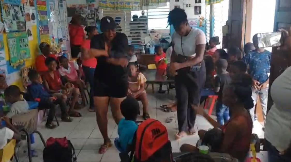 Adults dancing for the children at the Mount Olivet Basic School fun day last weekend.