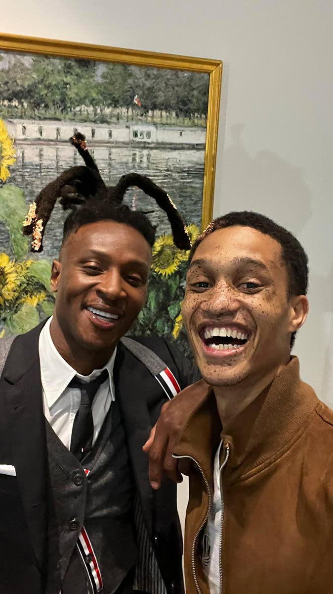 Ahead of their turns on the runway, Jamaican fashion star Romaine Dixon (right) laughed it up with DeAndre Hopkins, wide receiver for the Baltimore Ravens, who was Look 3 in the model line-up.