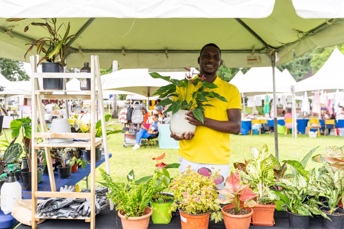 Anand Kumar, owner, Eclipse Florals and Plant Store, at Market on the Lawn in Kingston where five merchants were given the opportunity to display and sell their products by NCB.