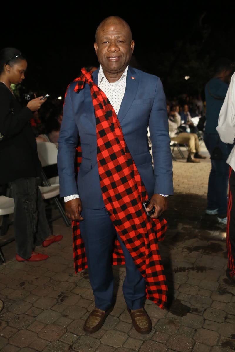 Jamaican-born Carlton Darby, founder and leader of Canada’s United Progressive Party, makes a statement in a tailored suit with chequered draping.