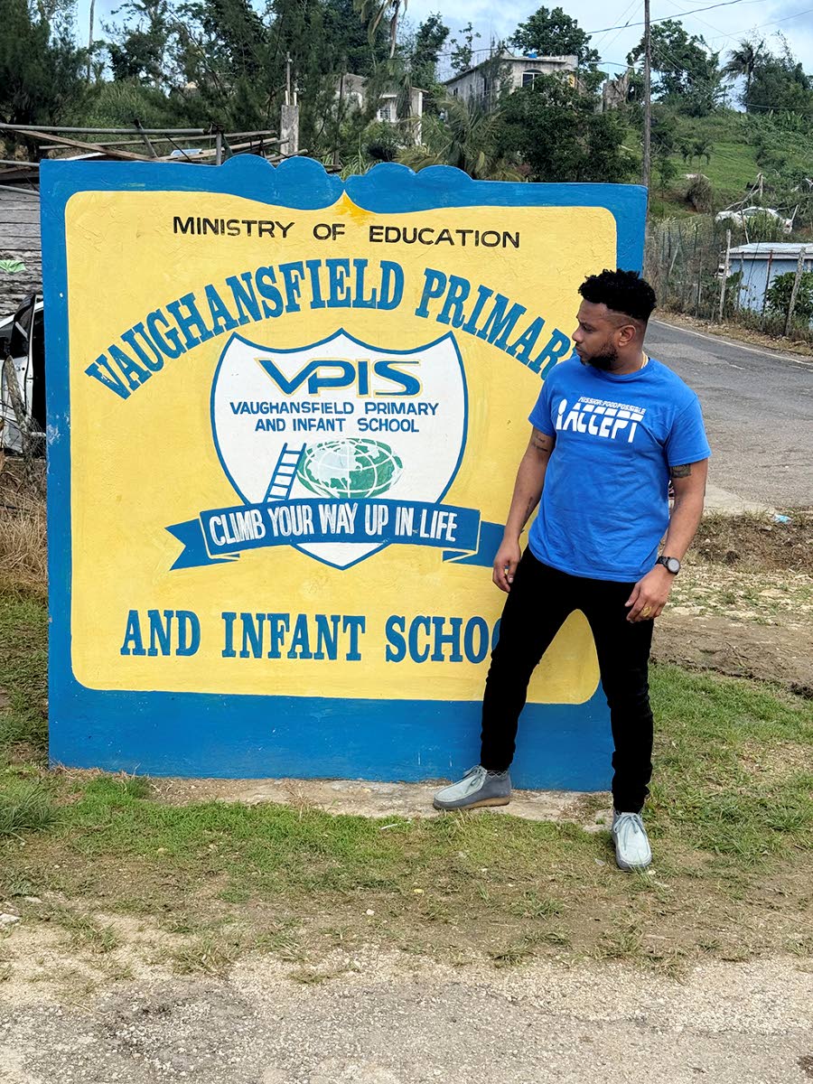 Peter Ivey, founder of Mission:FoodPossible, stands beside the entrance to Vaughansfield Primary and Infant School.