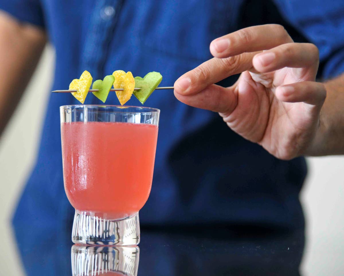 Skewered lemon peel hearts are added to the hearts on fire libation. 