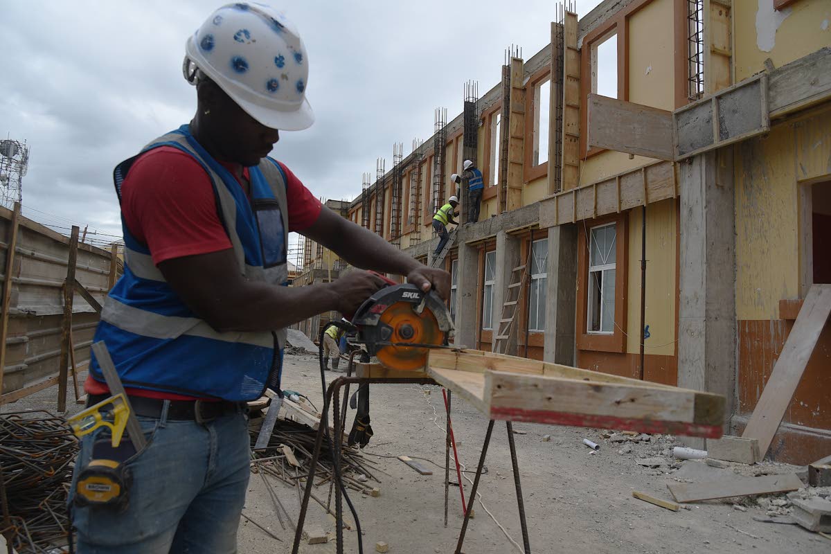 This photo shows a construction worker at Black River Hospital, which is undergoing repairs after it was damaged by Hurricane Melissa, last October.