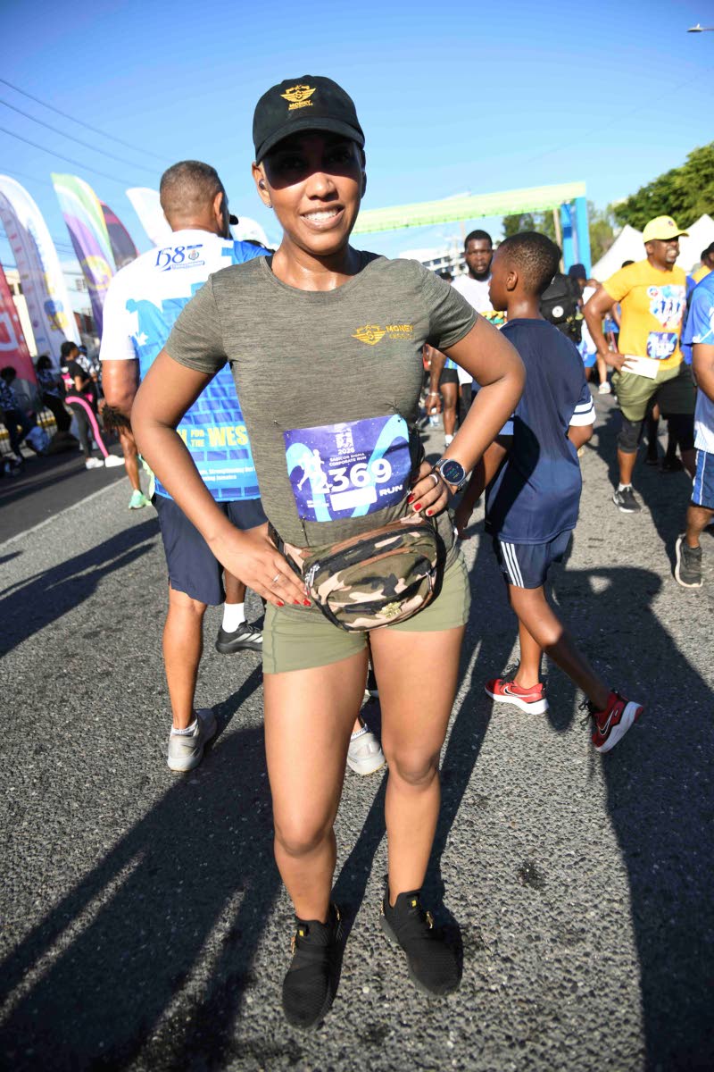 Representing her company, Money Media, Kalilah Reynolds proudly crossed the finish line, playing her part in raising funds to support schools in the western end of the island.