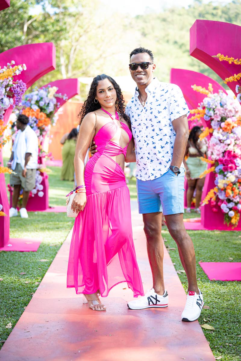 Trinidadian designer Emma Aqui, who created Yard Mas Carnival’s Starry Night costume, pauses for a photo op with Gen XS director Kibwe McGann.