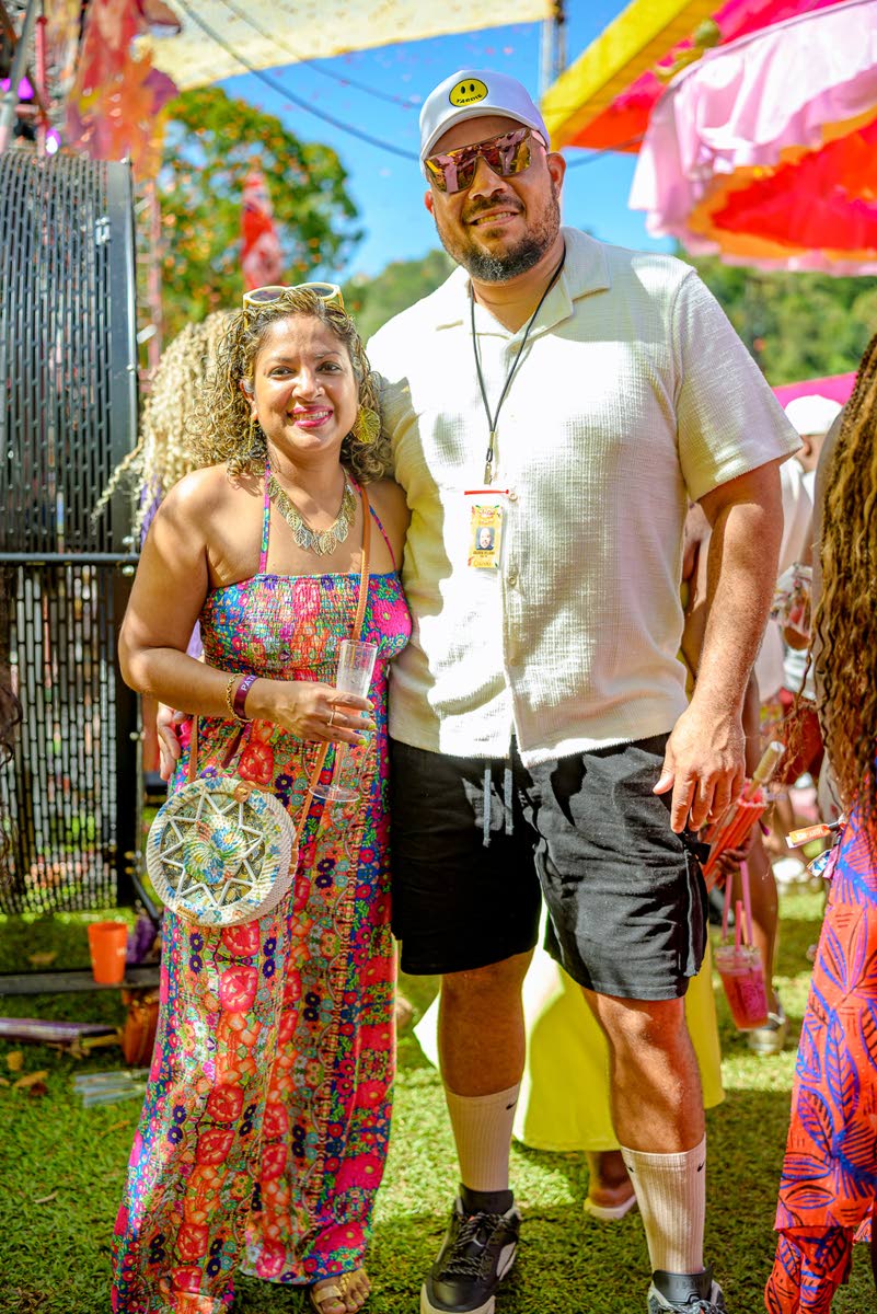 Andrew Bellamy, Yard Mas Carnival managing director, and his wife, Corrinne, assistant vice-president and employee benefits administrator in actuarial services at Sagicor Life Jamaica, soak up the fun together at Sunrise Breakfast Party in Trinidad.