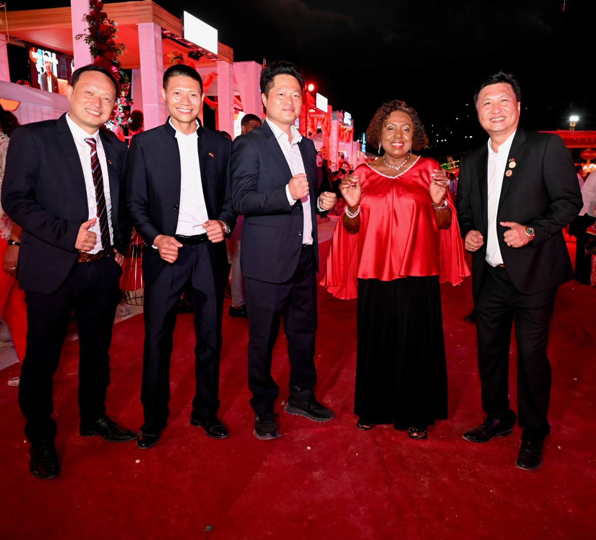 From left: Shifu Huang, CEO of Caribbean Solar Life; Yangsen Li, CEO of LCH Developments; business man Yucheng Tao; Culture Minister Olivia ‘Babsy’ Grange; and Ziping Chen, chairman of the Fujian Association of Jamaica, pause the festivities for a quic