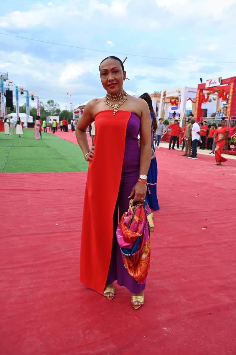 Sharon Hislop-Holt, manager of commercial development and marketing at MBJ Airports Limited, stuns on the red carpet, her sleek low bun finished with hairsticks.