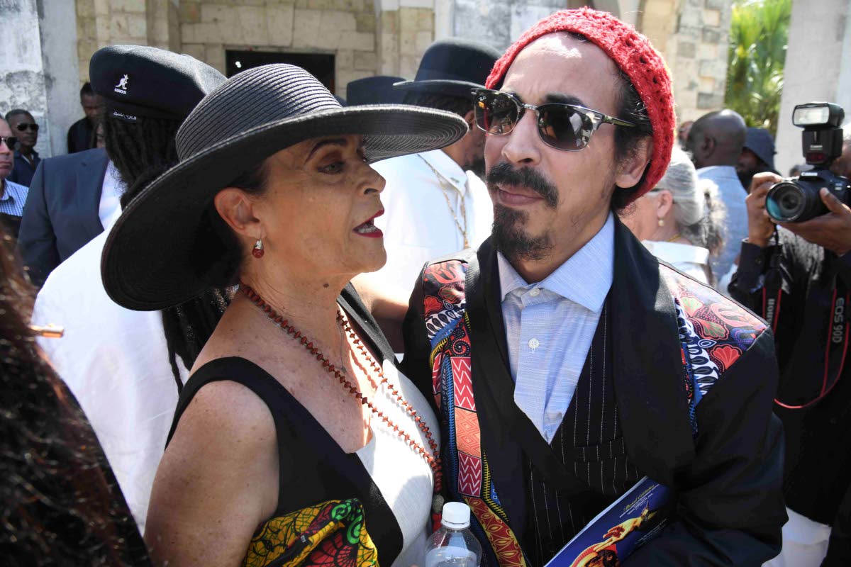 Cindy Breakspeare offers comforting words to Shiah Coore.