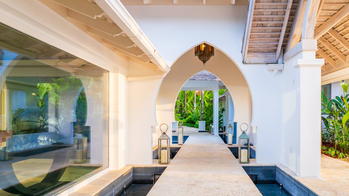 
Islamic arched walkways float over individual pools of water.