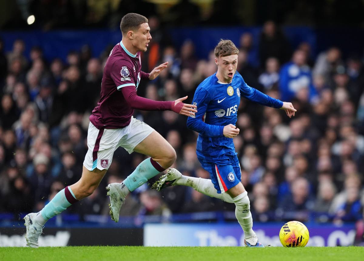 Burnley’s Maxime Esteve (left) and Chelsea’s Cole Palmer battle for the ball during their English Premier League football match in London yesterday.
