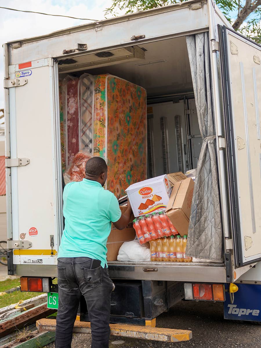  Supplies make their way from truck to community as donated goods are offloaded. 