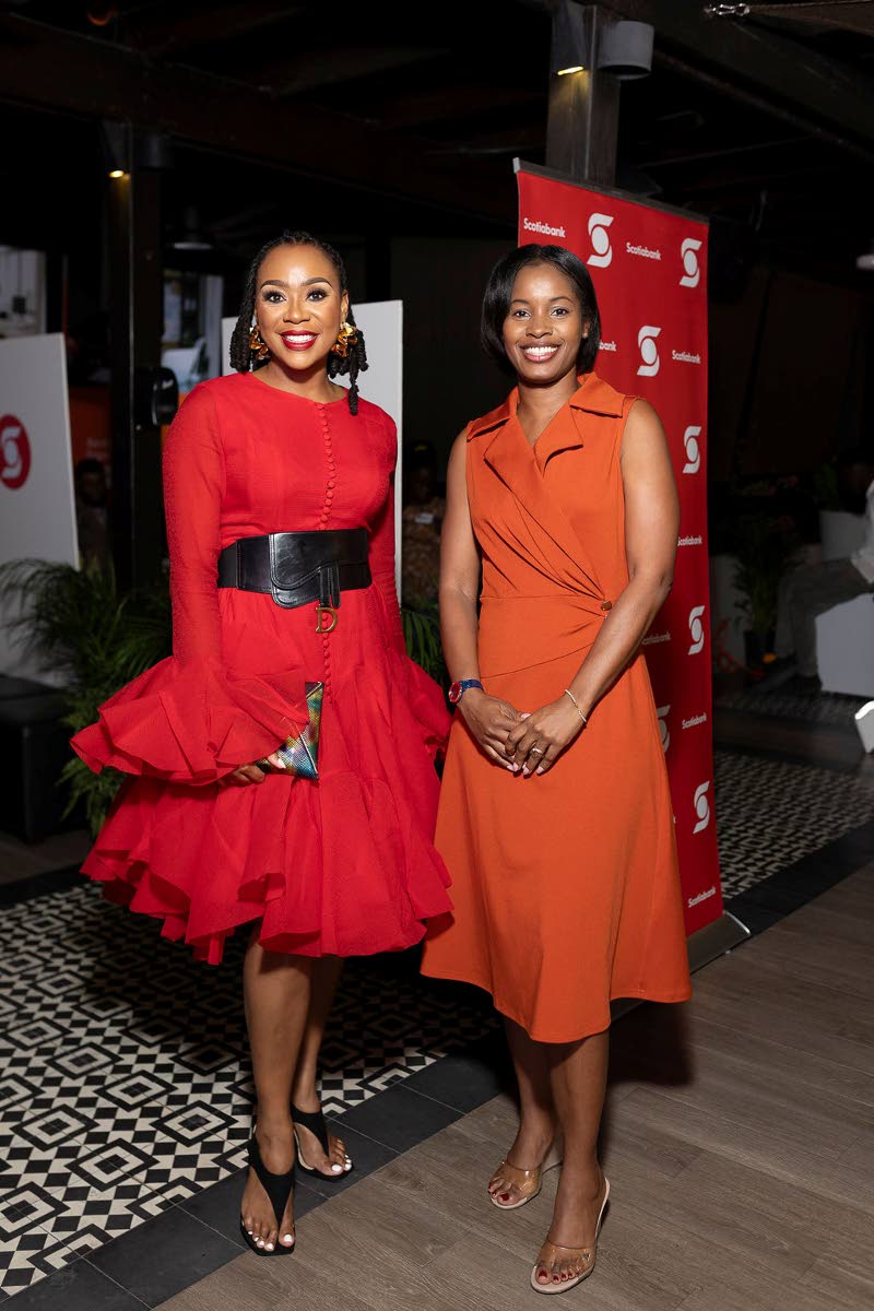  Krystal Tomlinson Carter (left), the evening’s emcee and founder of The Speakers’ Academy, shares a moment with Kimberly Gardner, public affairs and communications manager, Caribbean, North and Central, Scotiabank.