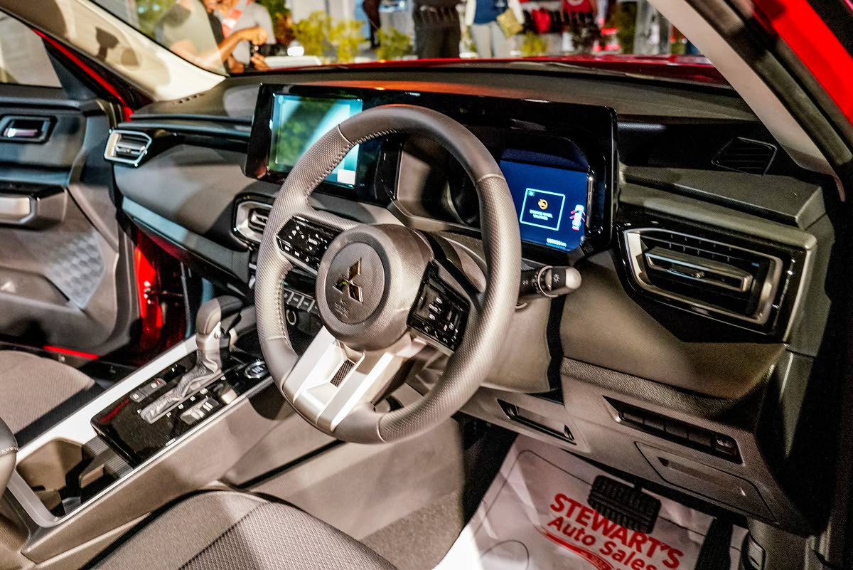 The cockpit of the Mitsubishi Destinator blends modern technology with upscale comfort, creating a driver-focused yet family-friendly environment. It features a roomy cabin with a monolithic 12.3-inch display that integrates entertainment and vehicle infor