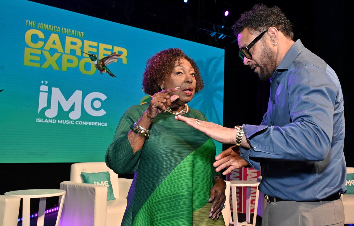 
Grange (left) speaks with Orville ‘Shaggy’ Burrell, founder and chairman of the Island Music Conference.