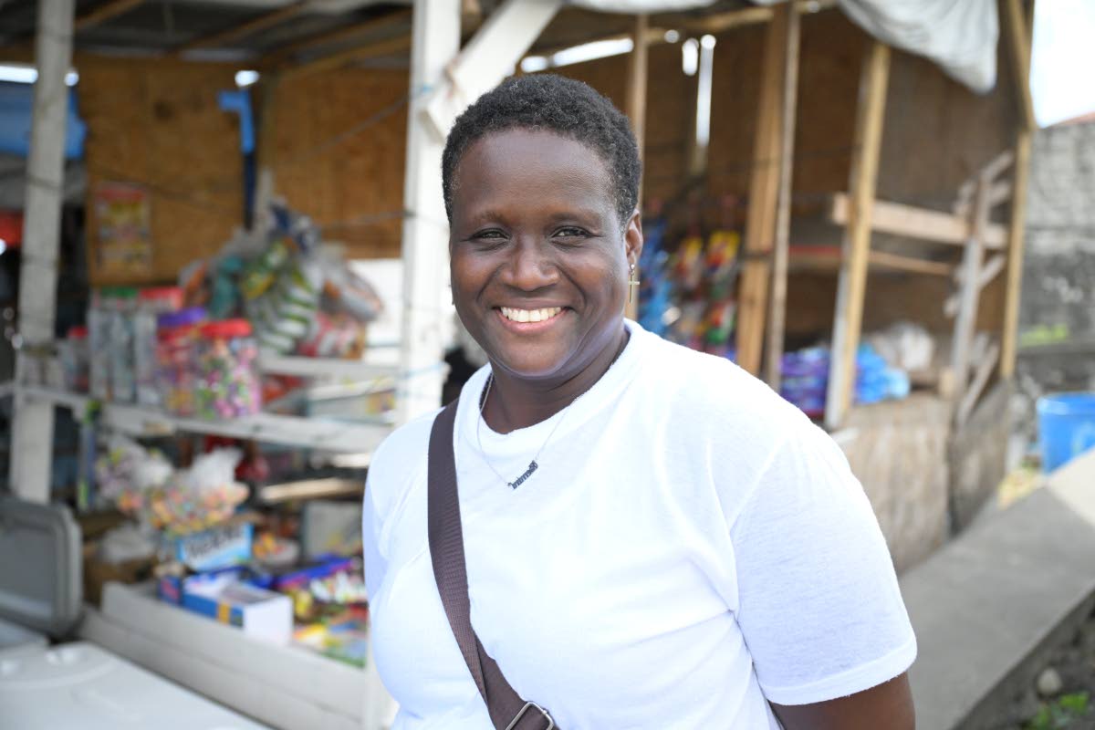 Melessa Hamilton of Pear Tree River expresses gratitude for the new shed at the Hope Road Transportation Centre in Morant Bay.