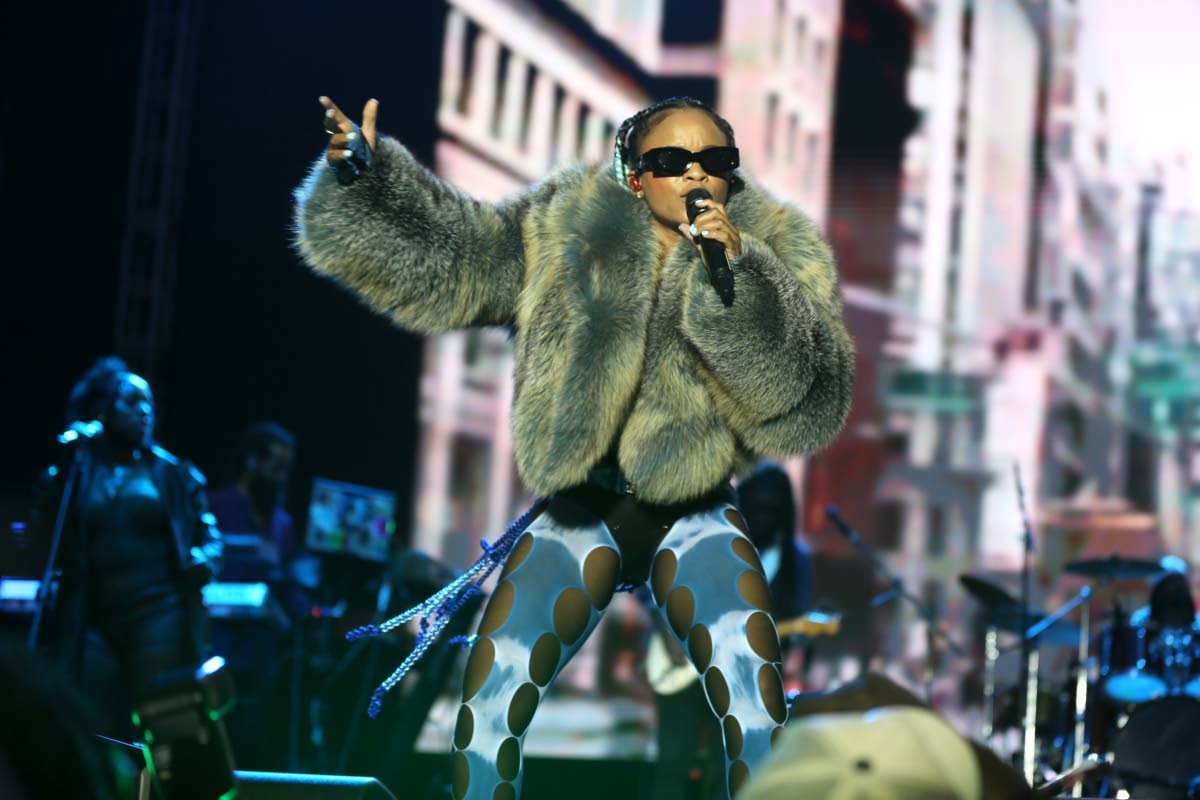 Lila Iké returns to join Protoje, rocking ripped tights and a fur coat.