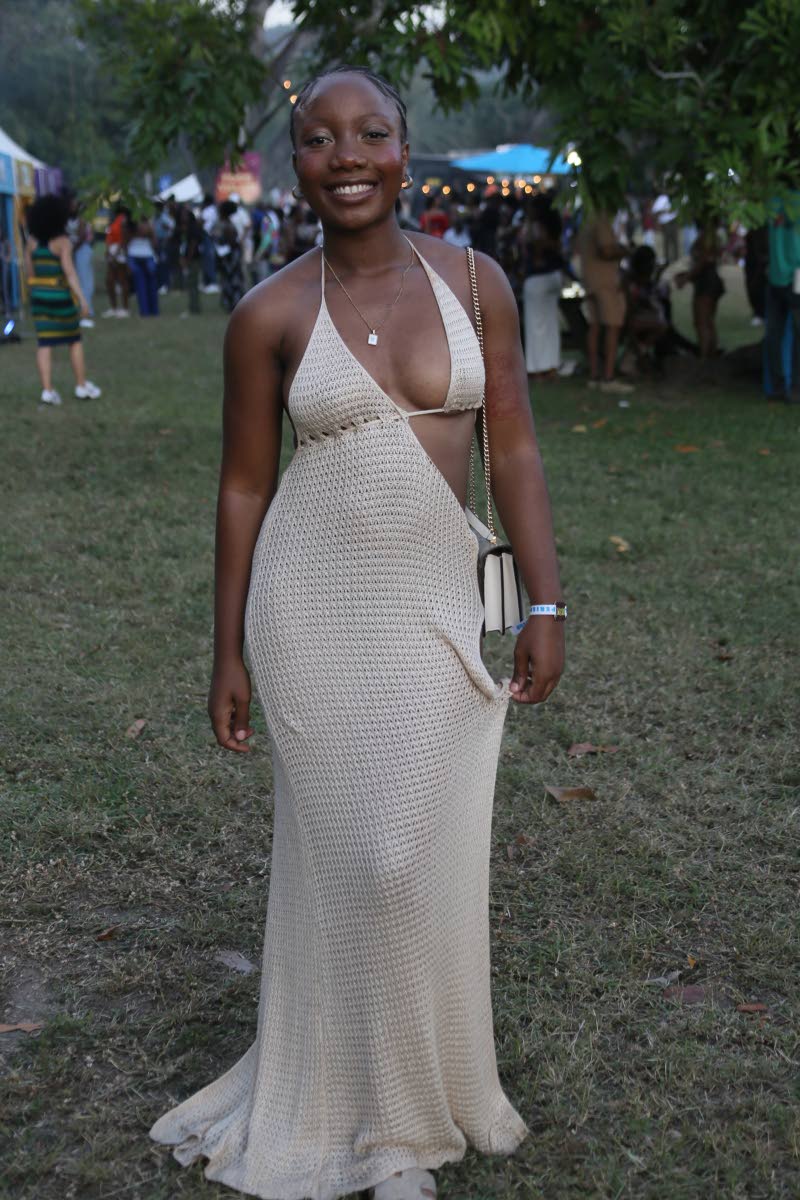Rhysha Brown, university student, catches our attention in a beige, crocheted maxi dress.