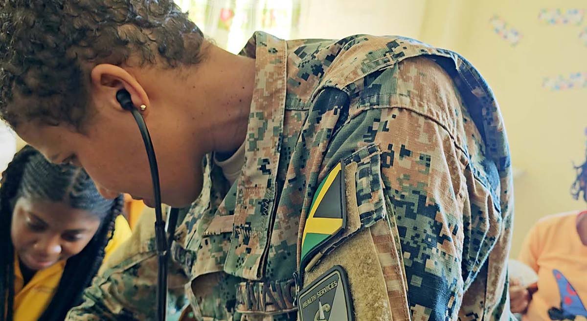 Captain Megan Murray of the JDF oversees the TTW and JDF medical team in carrying out health and wellness screenings at Blessed Assurance Children’s Home on Saturday February 28.