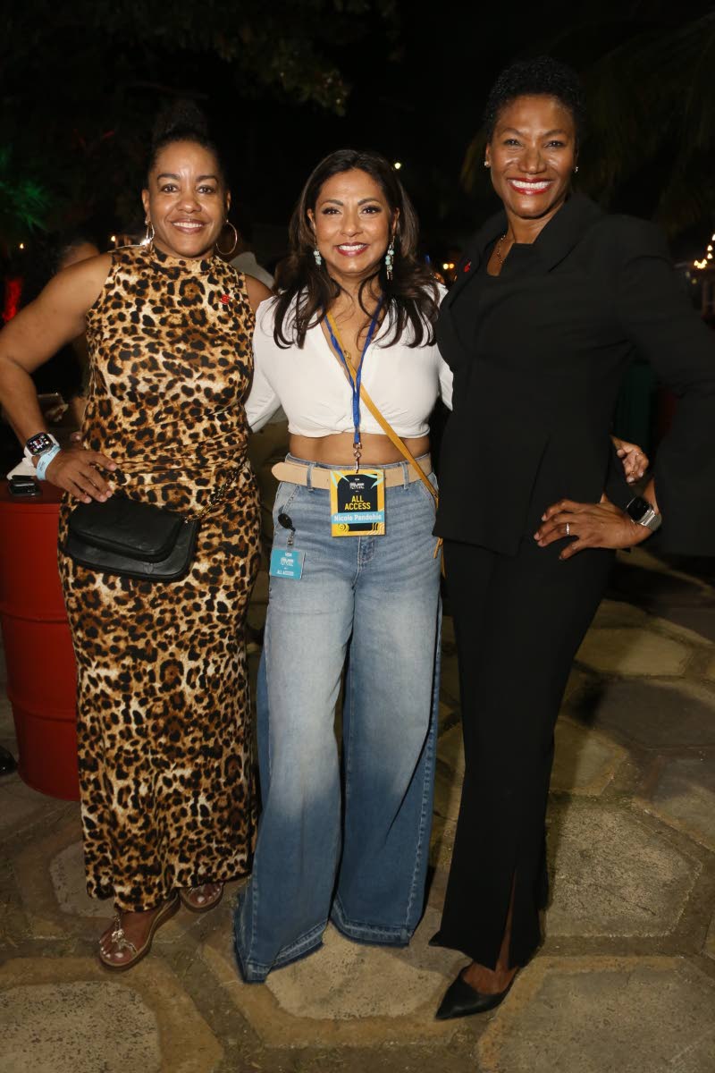 Avril Leonce (left), retail director and head of non-branch sales, Scotia Group Jamaica and Audrey Tugwell Henry (right), president and CEO of Scotia Group Jamaica, share the frame with Festival Director Nicole Pandohie.