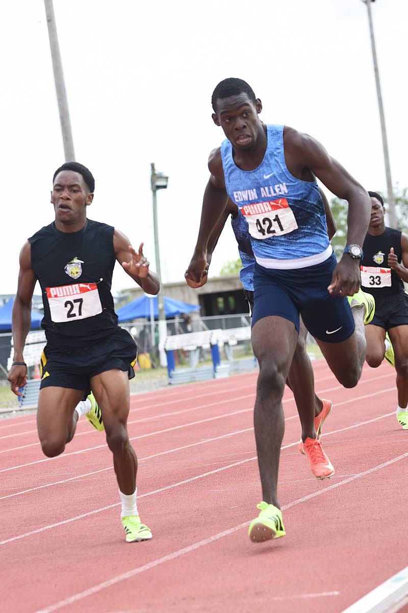 Alphansus Davis High School’s Nicholas Federick (left) pushes Edwin Allen High School’s Joel Moran to the line during the Class 1 boys’ 800 metres at the ISSA Central Athletics Championships at GC Foster College recently.