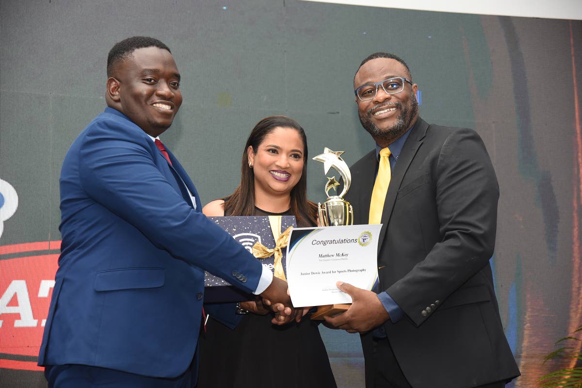 Above: The Gleaner’s Matthew McKoy (left) collects the Junior Dowie Award for Sports Photography from President of the Press Association of Jamaica Dashan Hendricks (right), and Shemala Pullen of Television Jamaica. 